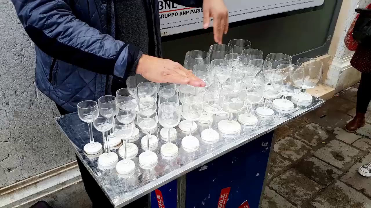 Street Performer Plays Harry Potter's Theme Song on Glass Harp