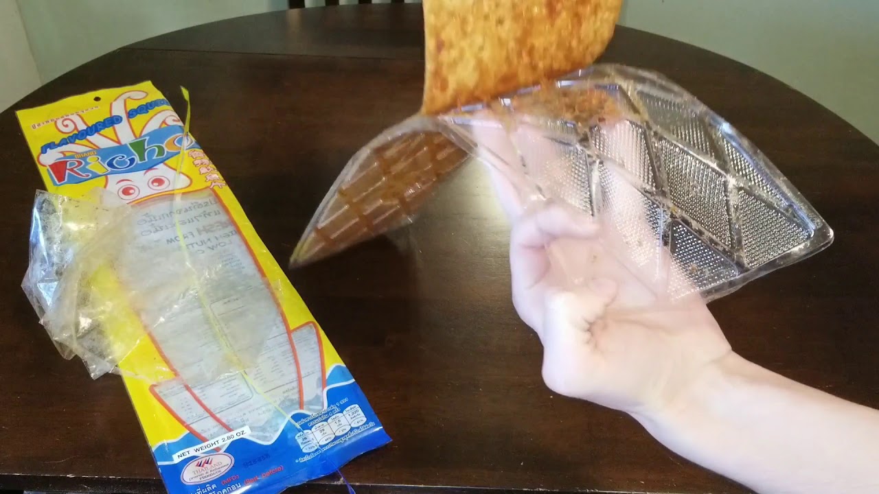 Eating Giant Piece Of Squid Jerky From Thailand