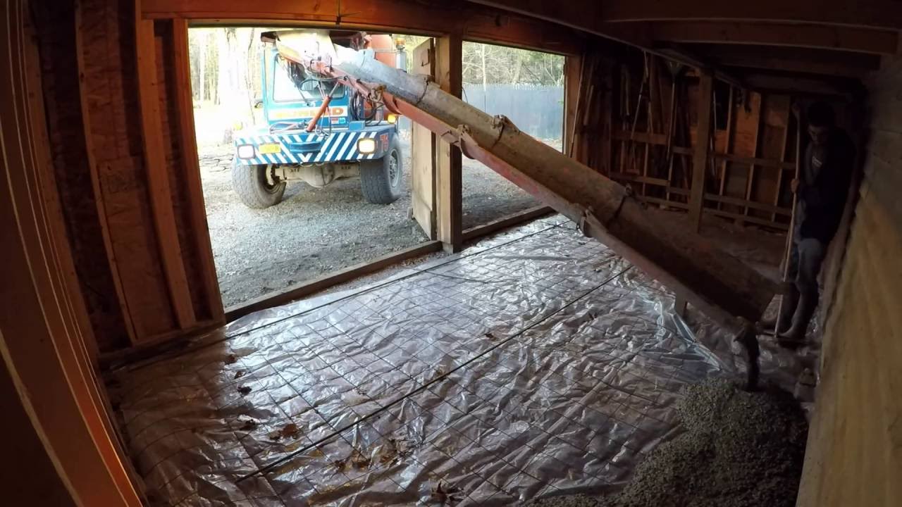 Pouring a concrete floor in a shed