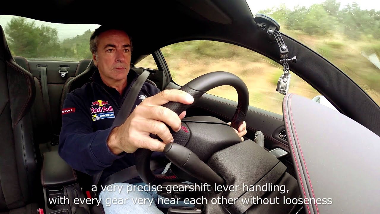 Carlos Sainz, at the wheel of the Peugeot RCZ R