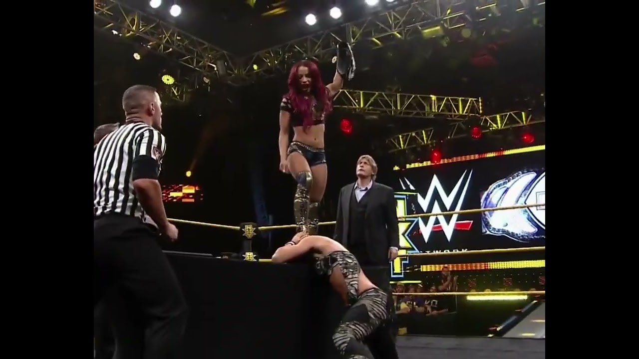 Sasha Banks victory pose on Becky Lynch 