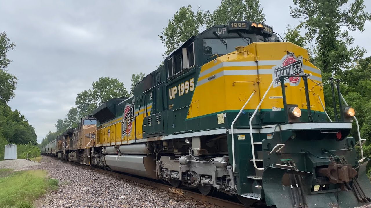UP 1995 (CNW Heritage Unit) Leads a Speedy Grainer Down the River Subdivision - 8/6/24