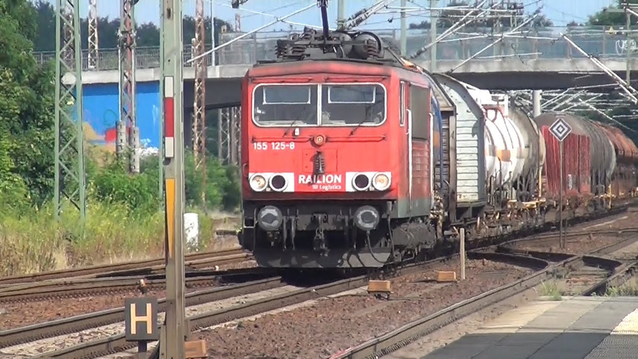 Freight train with DB Railion 155 125 8 passes through the station  