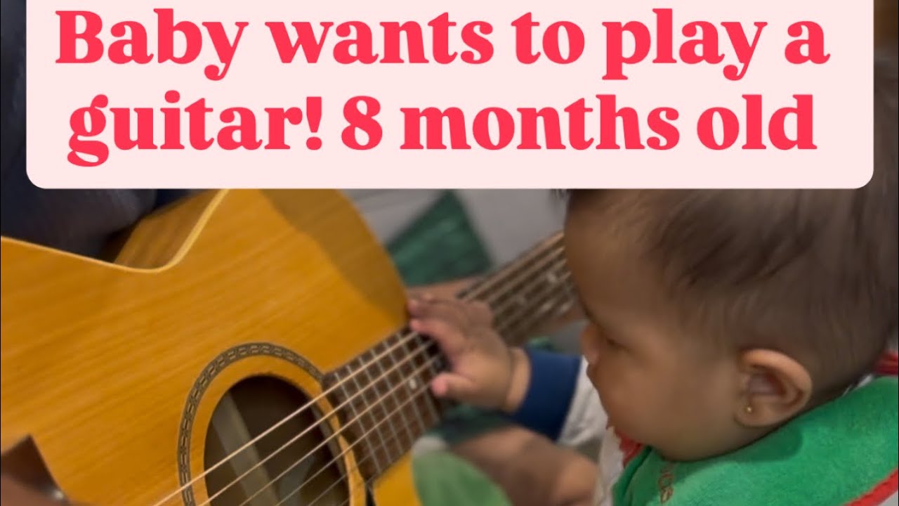 Baby wants to play guitar now.! 