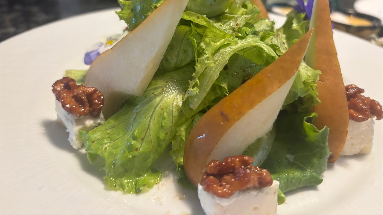 Salad greens with Bosc Pear, Roquefort Cheese and Caramelized Walnuts