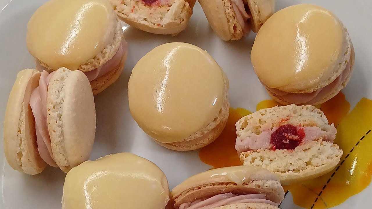 Macarons with Raspberry ganache, glazed with white chocolate