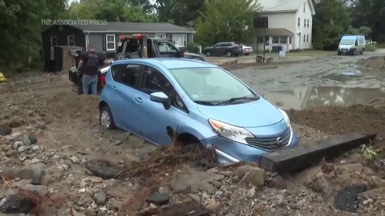 New England getting more rain as officials look into high winds that toppled trees, power lines