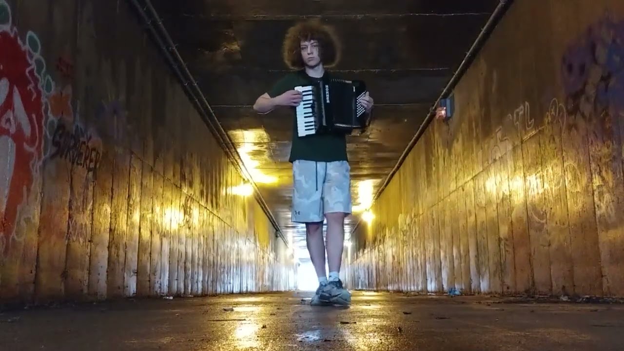 Playing Piano Man on an accordion in a sketchy tunnel