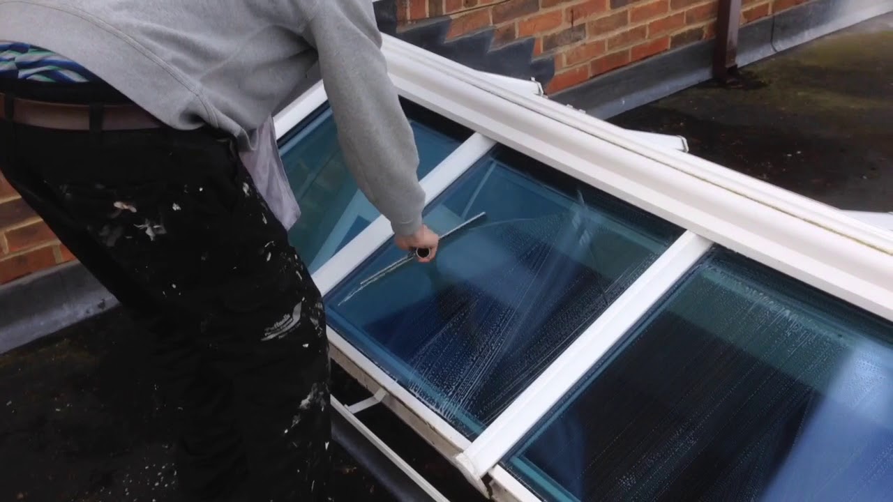 Traditional window cleaning a glass roof