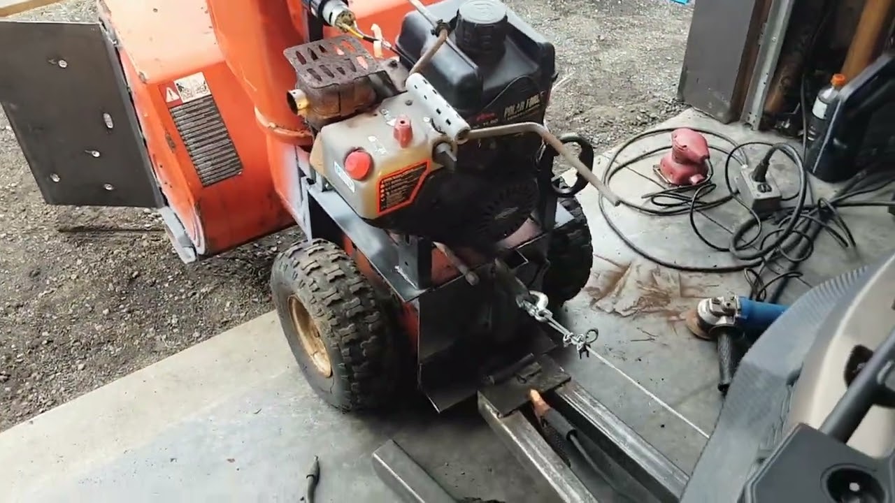 ATV Front mount Kustom snowblower.