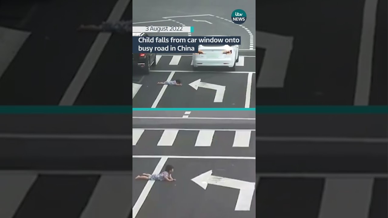 Child falls from car window onto busy road in China