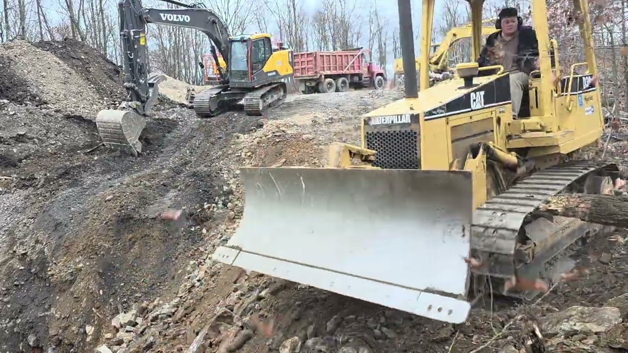Leveling a road with cat D3 dozer.