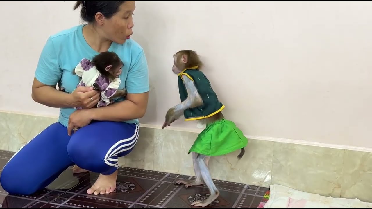 OH ! No mom try to stop naughty Sovanny to chase sister Kobie form mom .