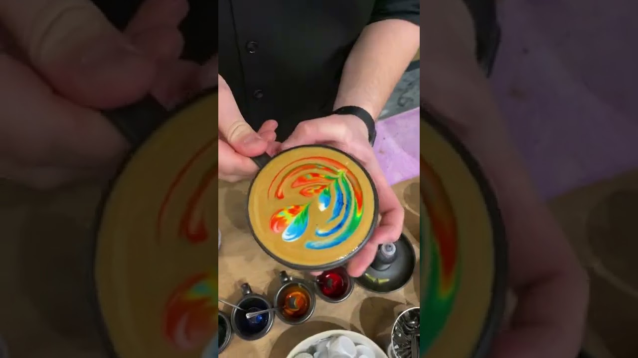 Barista doing some crazy colored coffee art 🤯