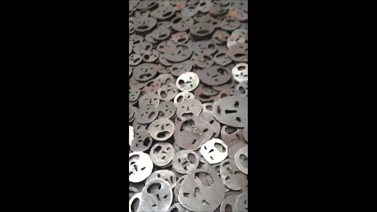 Jewish museum exhibit of 10,000 metal faces like leaves