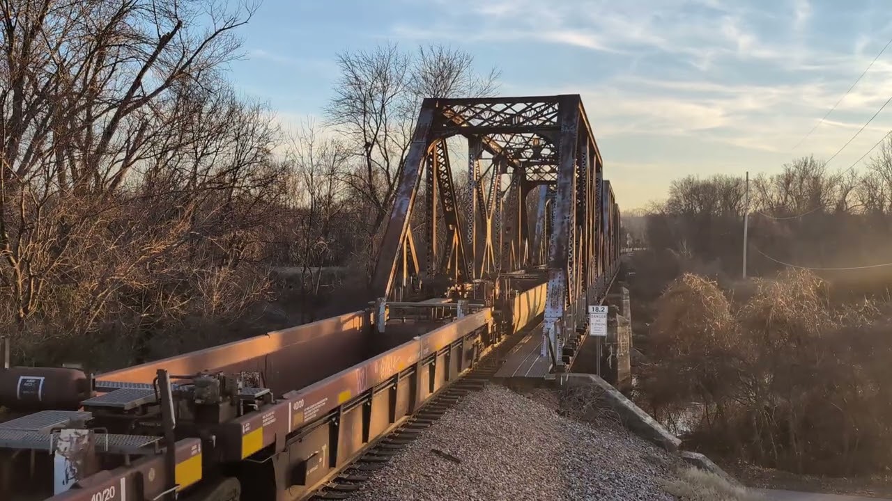 Caught a train in Fenton across the old steel trestle bridge. Led by up and followed by BNSF