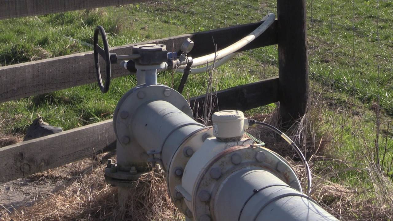How does a water meter help farmers manage their water consumption?