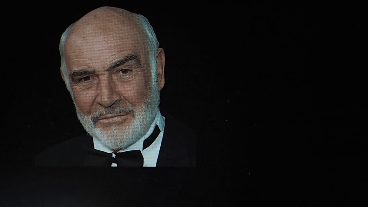 E-M1II video C-AF face tracking with a face on a monitor and a lens cap