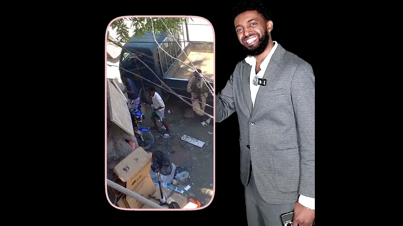 Saraakiil caan ah & Askartooda oo jidka dhexdiisa ku dhex cabaya Biyo & Sigaar kuna hor cunteynaya |