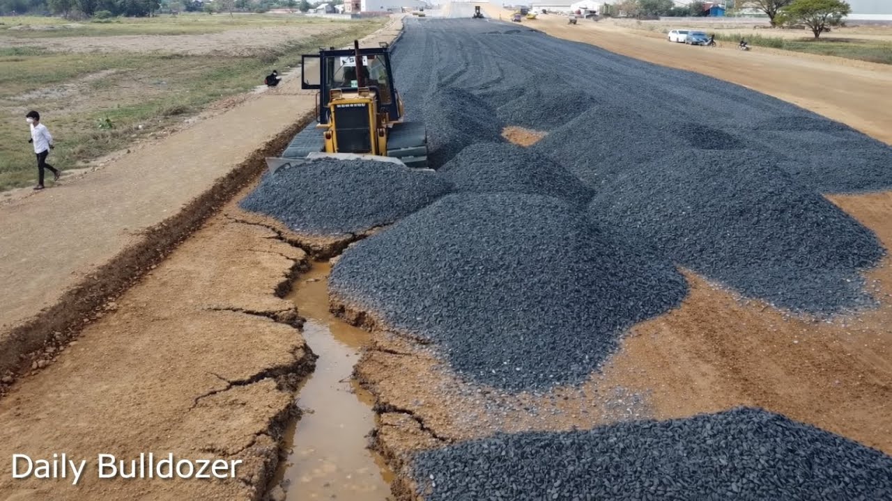 Strong Bulldozer Clearing Gravel Coverage An Old Road 