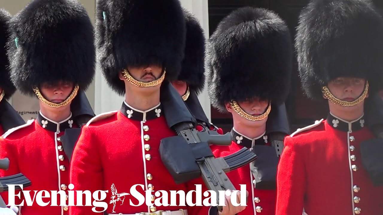 Queen's Guard perform Changing of the Guard ceremony during scorching heatwave