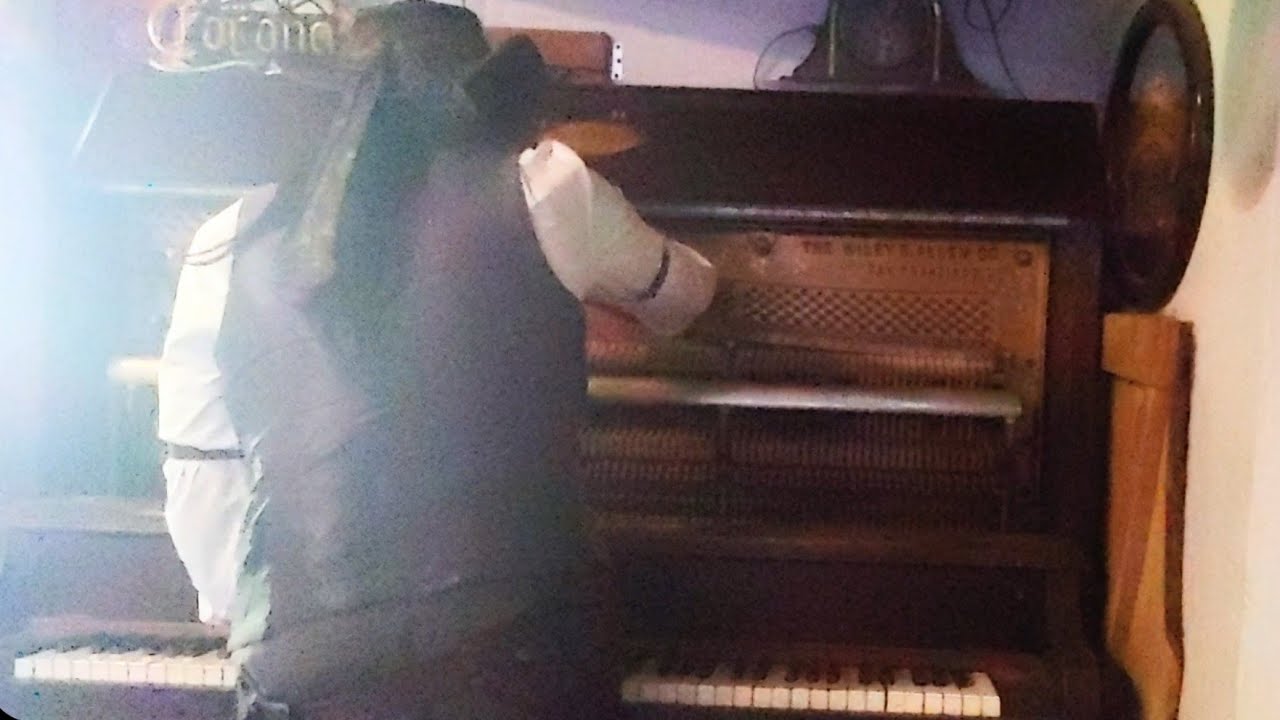 Playing saloon piano mid-tuning, Water Wheel Saloon, Sonora California