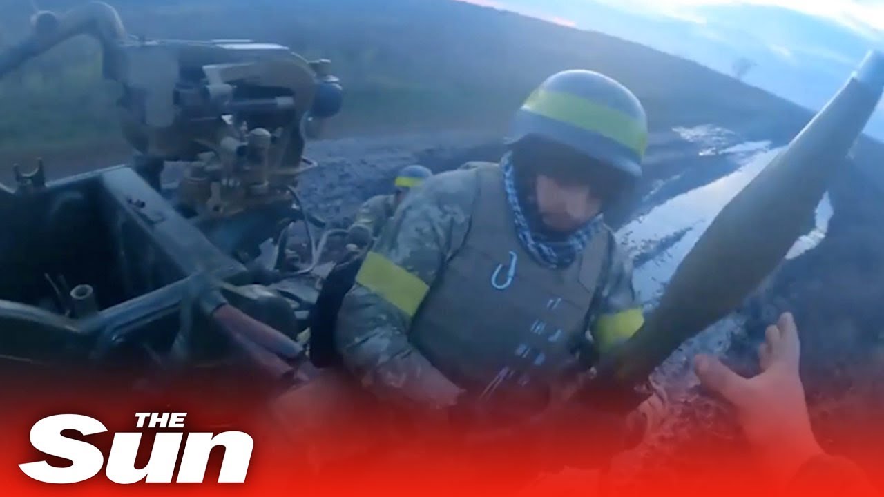 Ukrainian soldiers jump from tanks and fire rockets at Russian targets