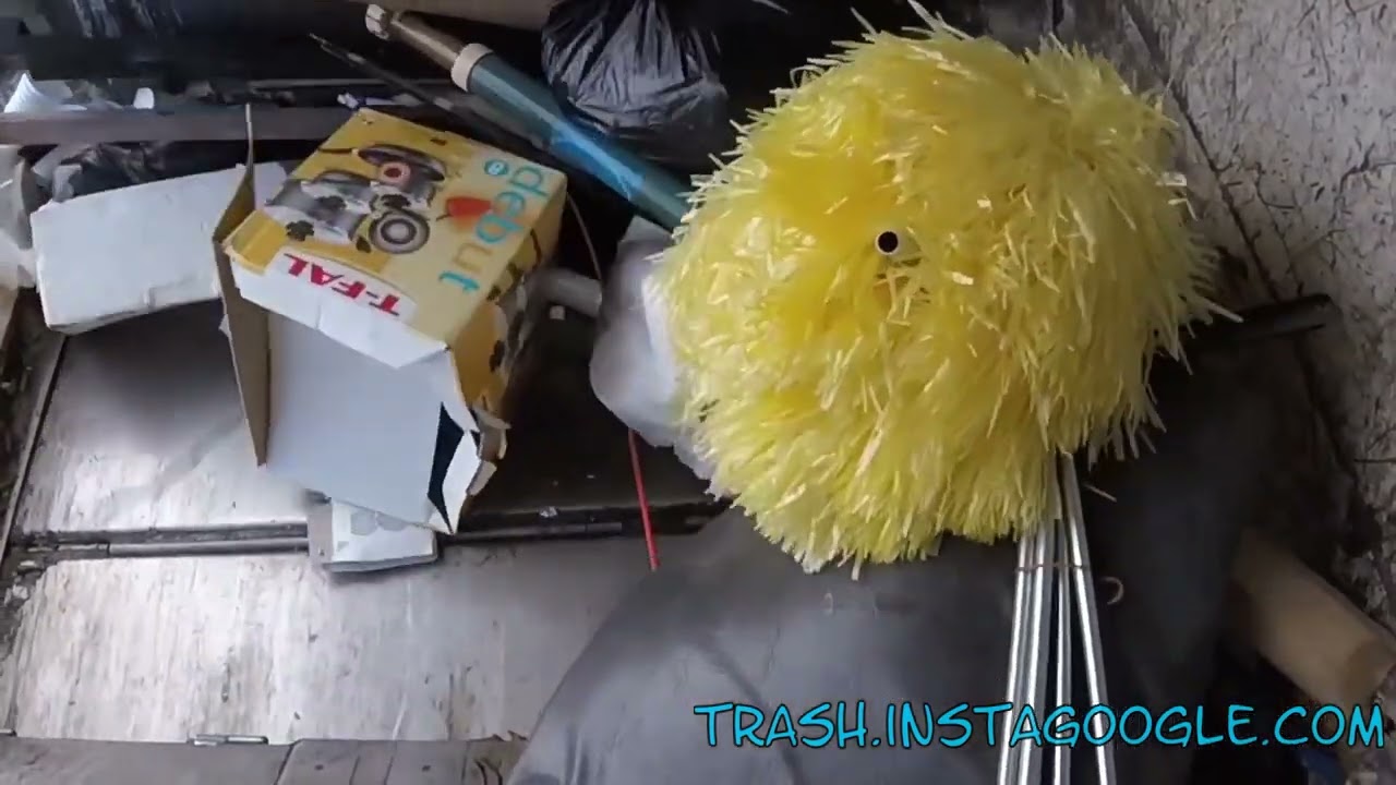 Watch Garbage Bags Get Squashed in a Powerful Trash Compactor Truck
