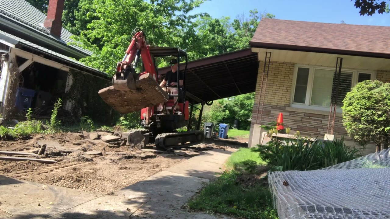 Concrete sidewalk removal with Yanmar mini excavator in Guelph