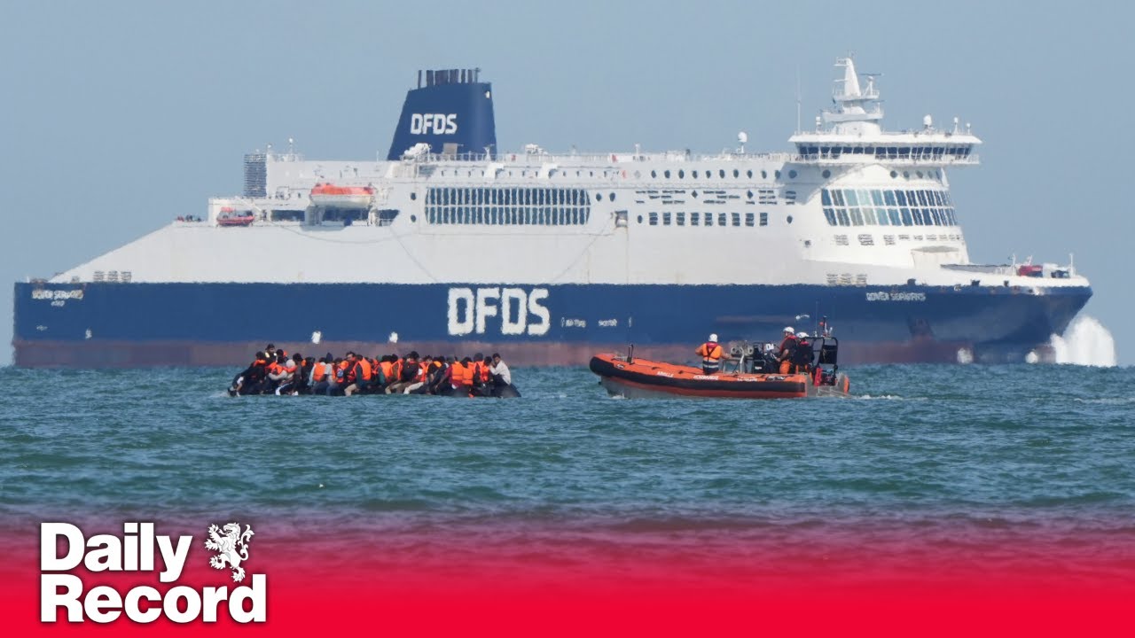 Migrants cross Channel in dinghy as they pass big ships off French coast