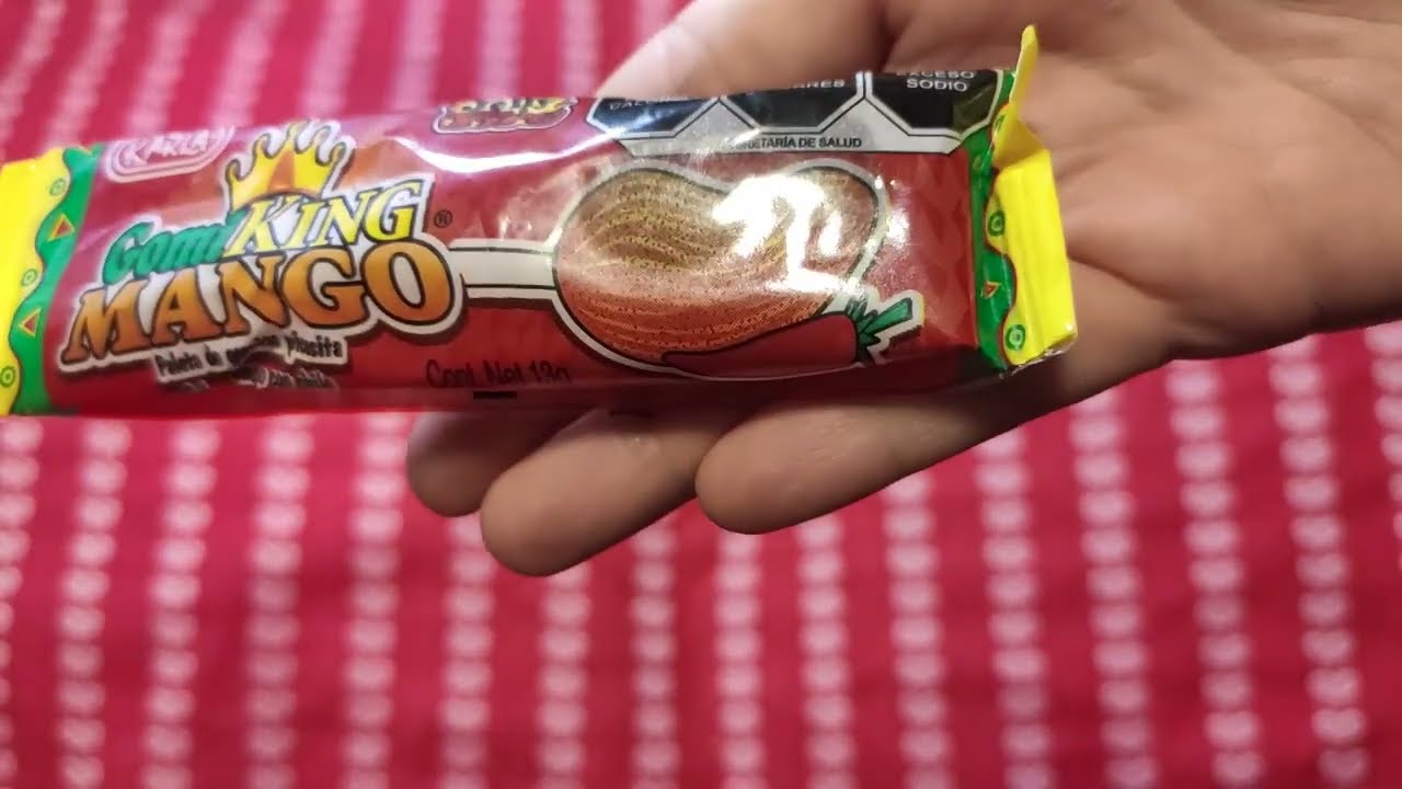 Opening Gomi King Mango gummy lollipop by Dulces Karla