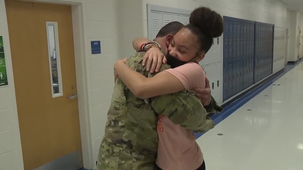 Military dad surprises daughters at school by returning home early