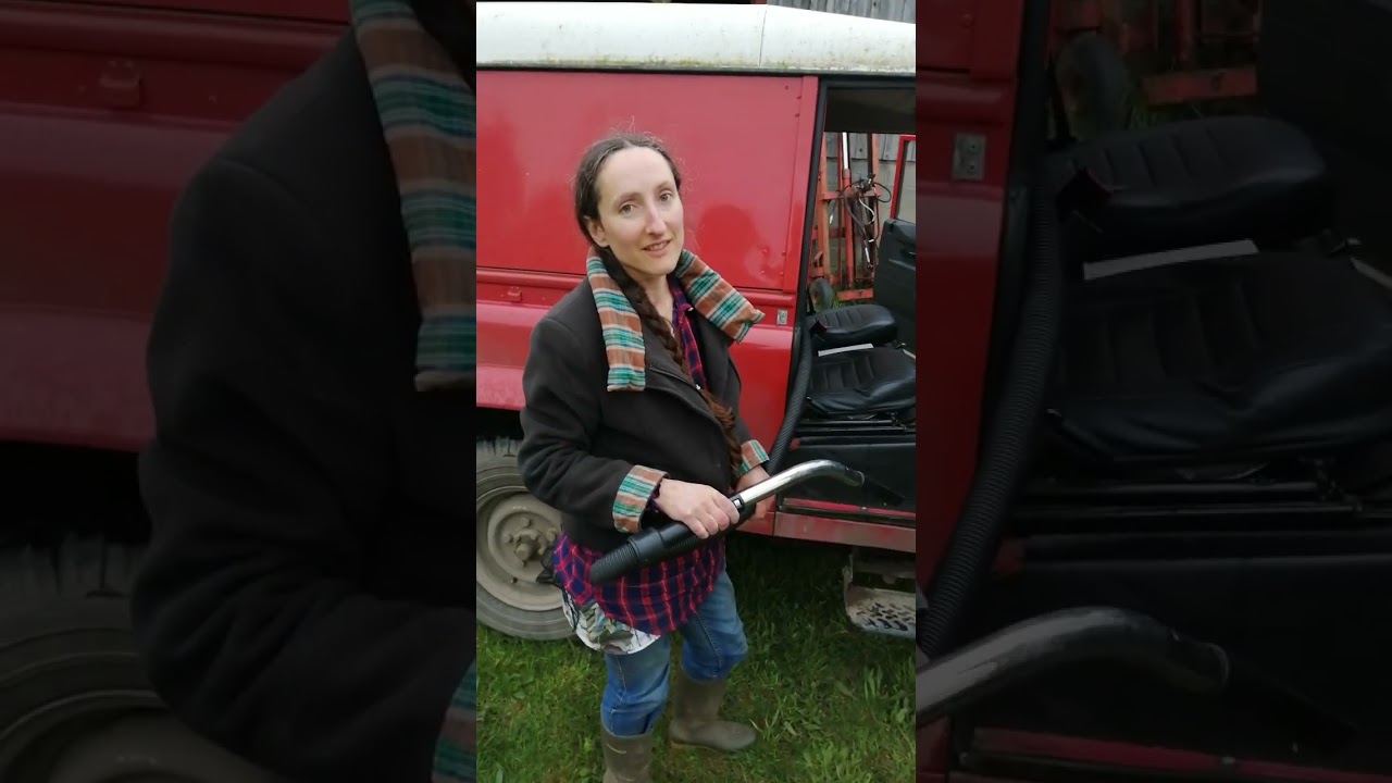 Vacuuming the front of the land Rover with grit and stones on the floor and hoover parts/bag
