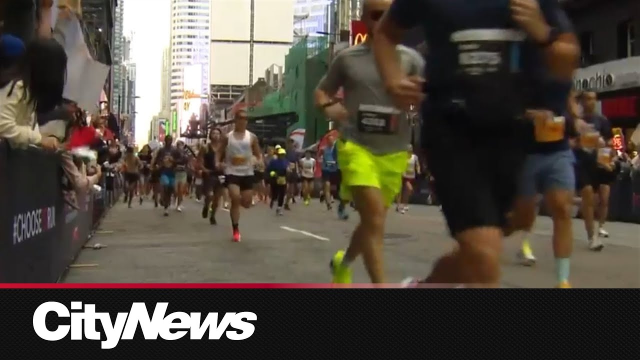 Thousands of runners take part in the TCS Toronto Waterfront Marathon