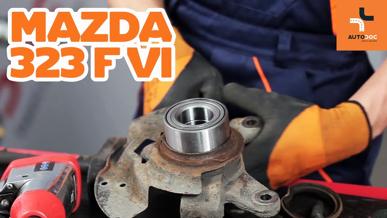 How to change a front wheel bearing on MAZDA 323 TUTORIAL | AUTODOC