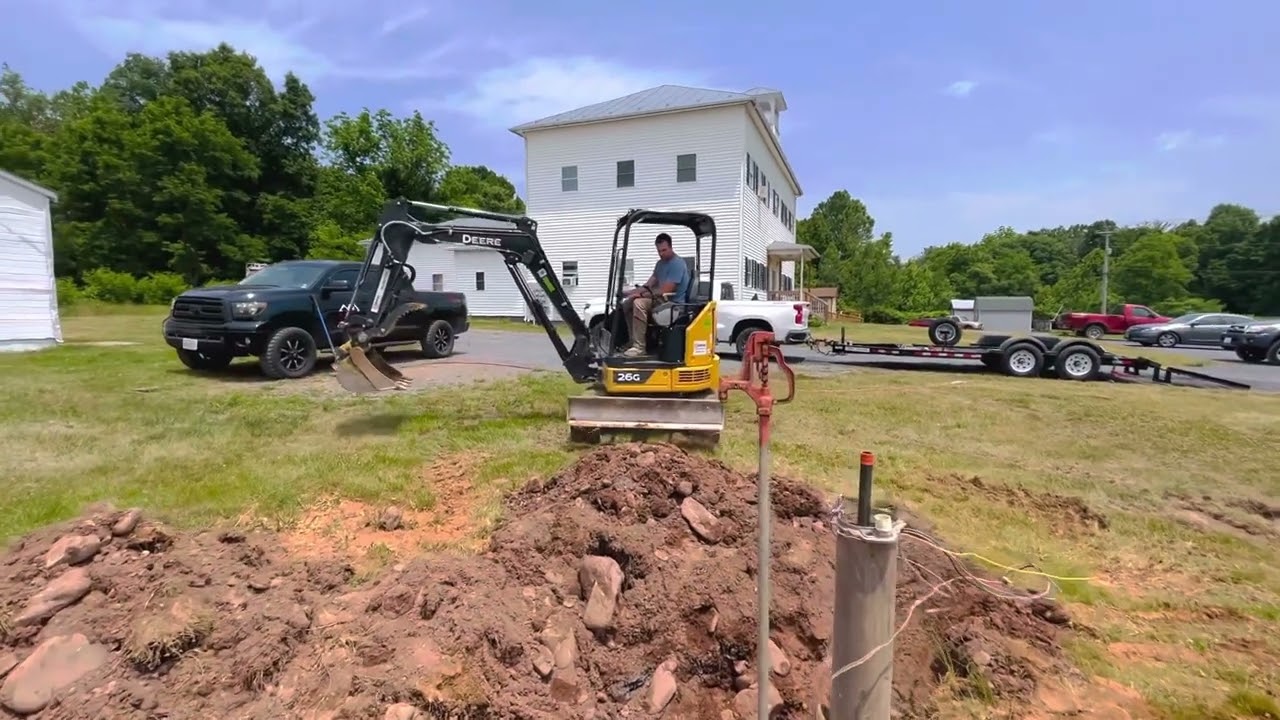 John Deere 26G mini excavator/ reconnecting well