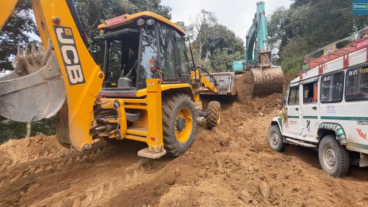 Jcb Backhoe and Kobelco Excavator-Widening Hilly Road-Making Way for Passing Vehicles