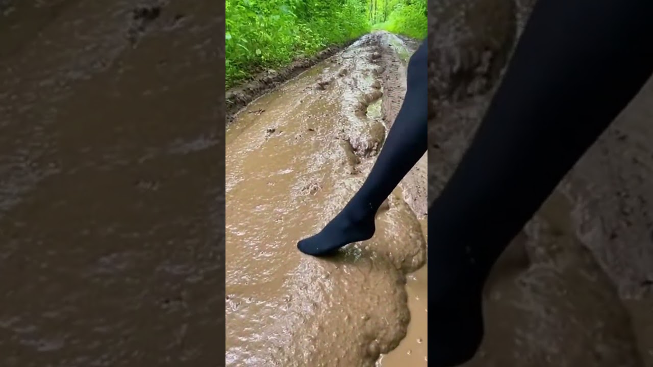 The girl in black tights sank deep into the mud