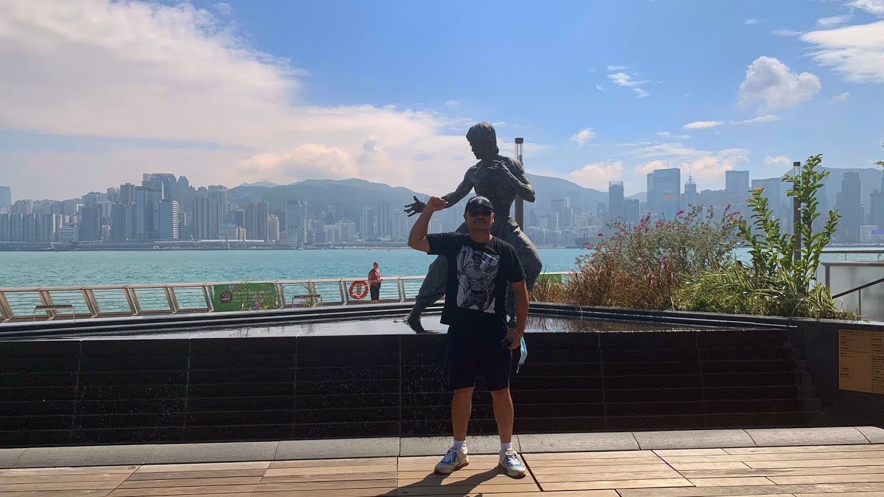 Visiting Bruce Lee Statue at Avenue of Stars from Mira Hotel in Hong Kong