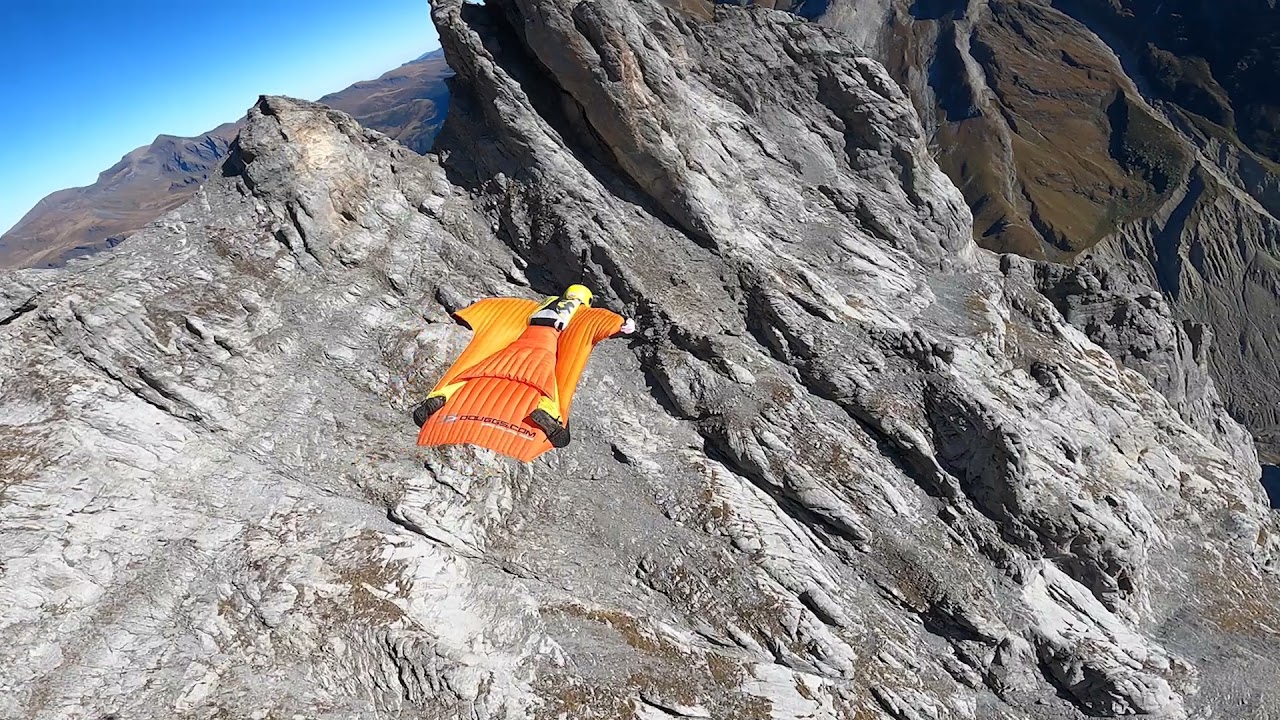 RidgeMonster.com Douggs WingSuit pilot flying Eiger Mountain Switzerland & cameraman Sam Hardy.