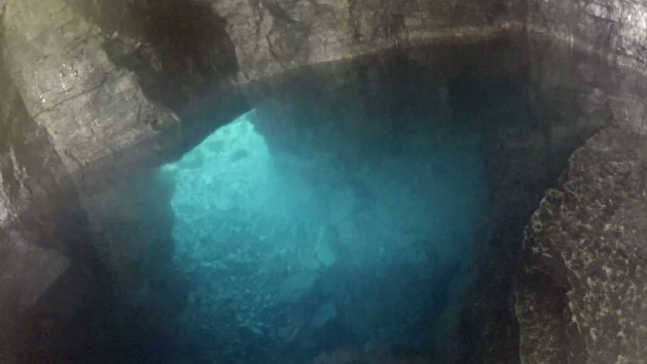 Exploring the Grotto: Cave around the left bend, pool inside!