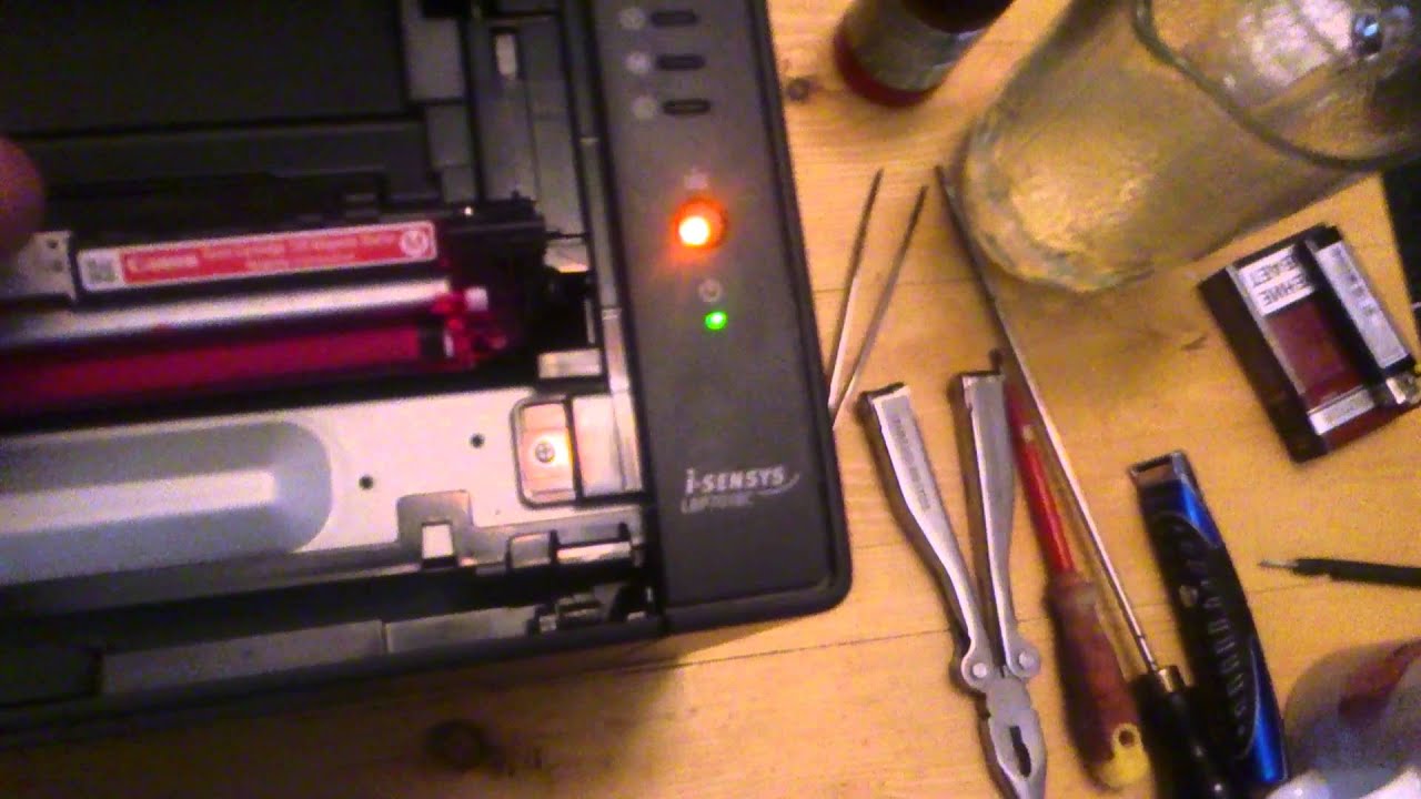 Canon LBP7018C как вытащить картридж