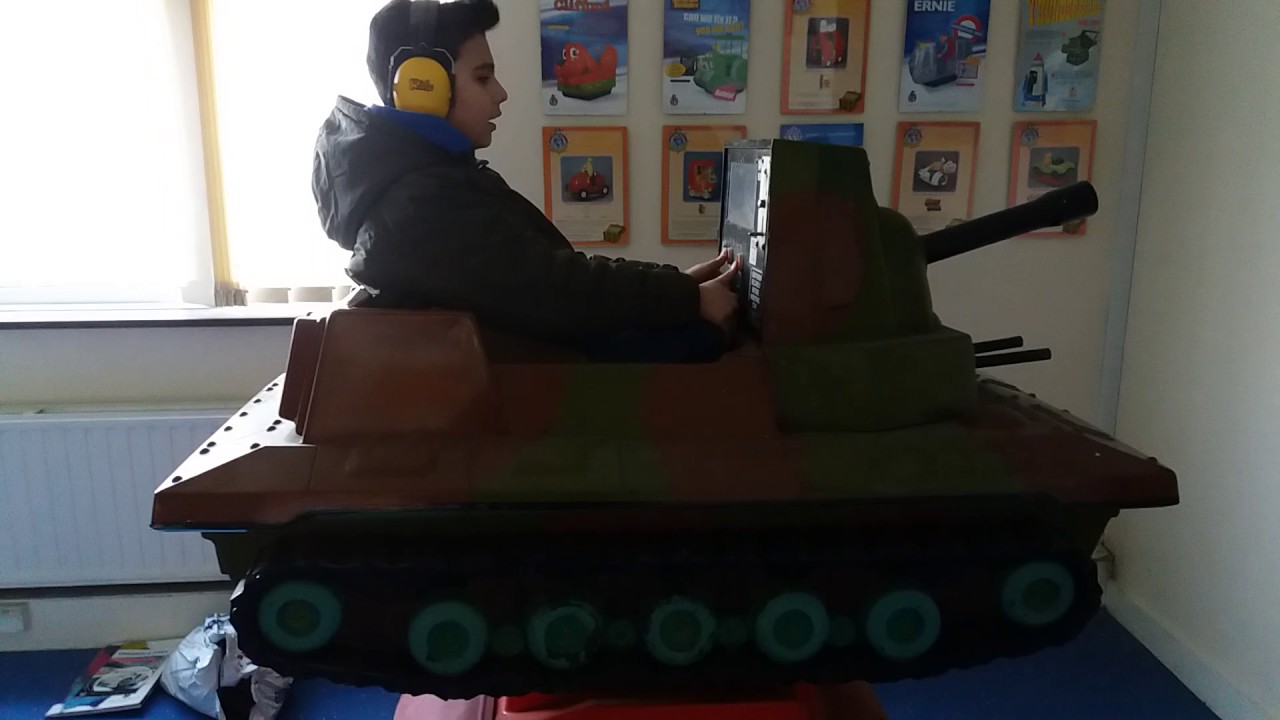 Leo on a vintage tank kiddie ride
