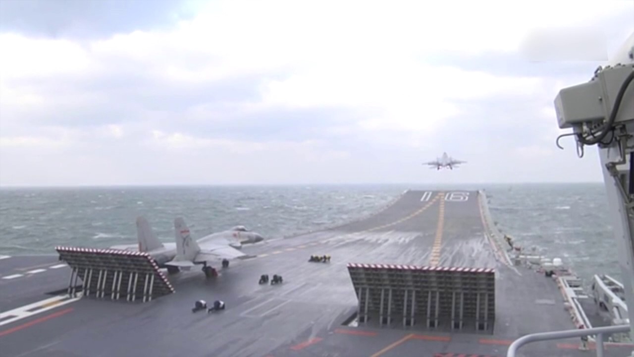 Chinese aircraft carrier Liaoning carries out drill with J-15 jets on board