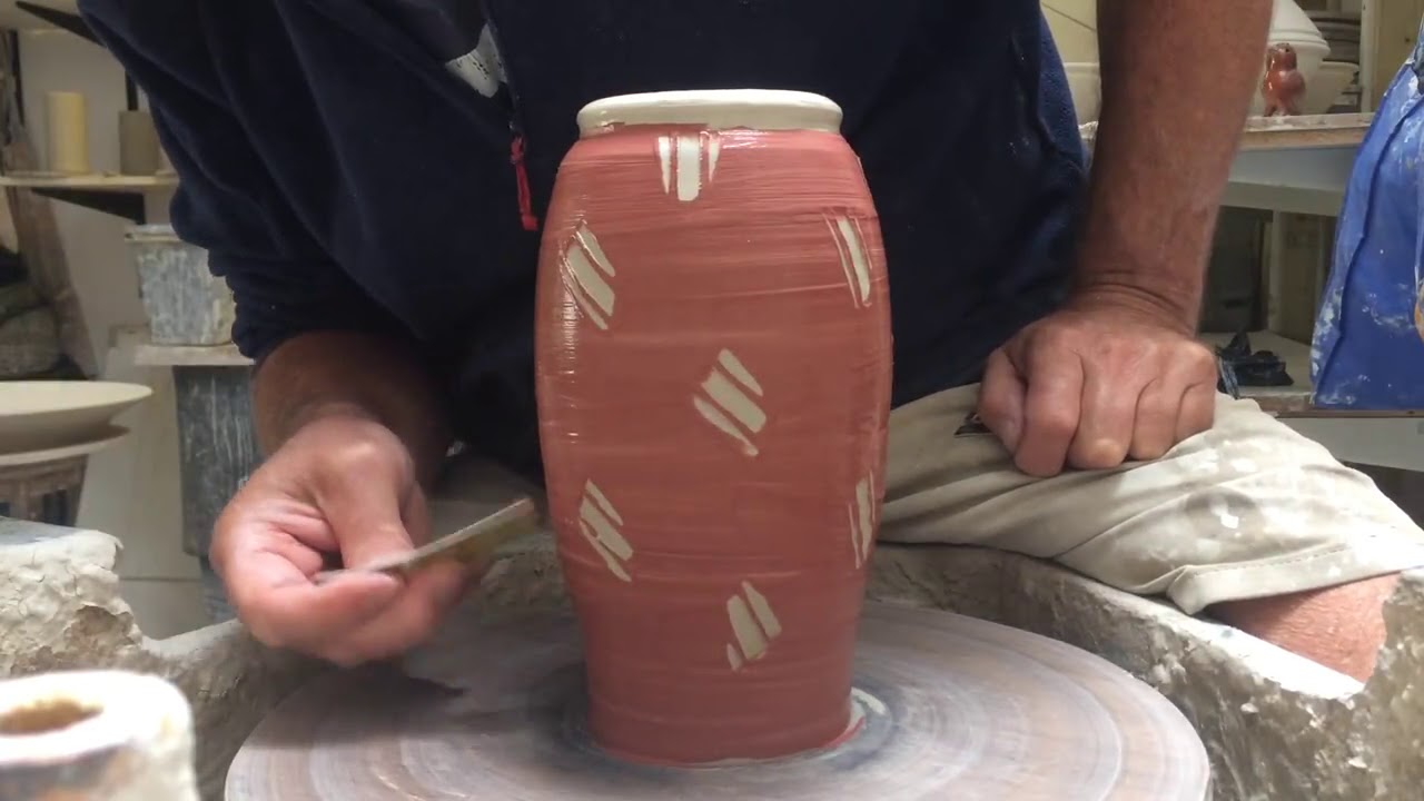Stoneware/slipware surface decoration.