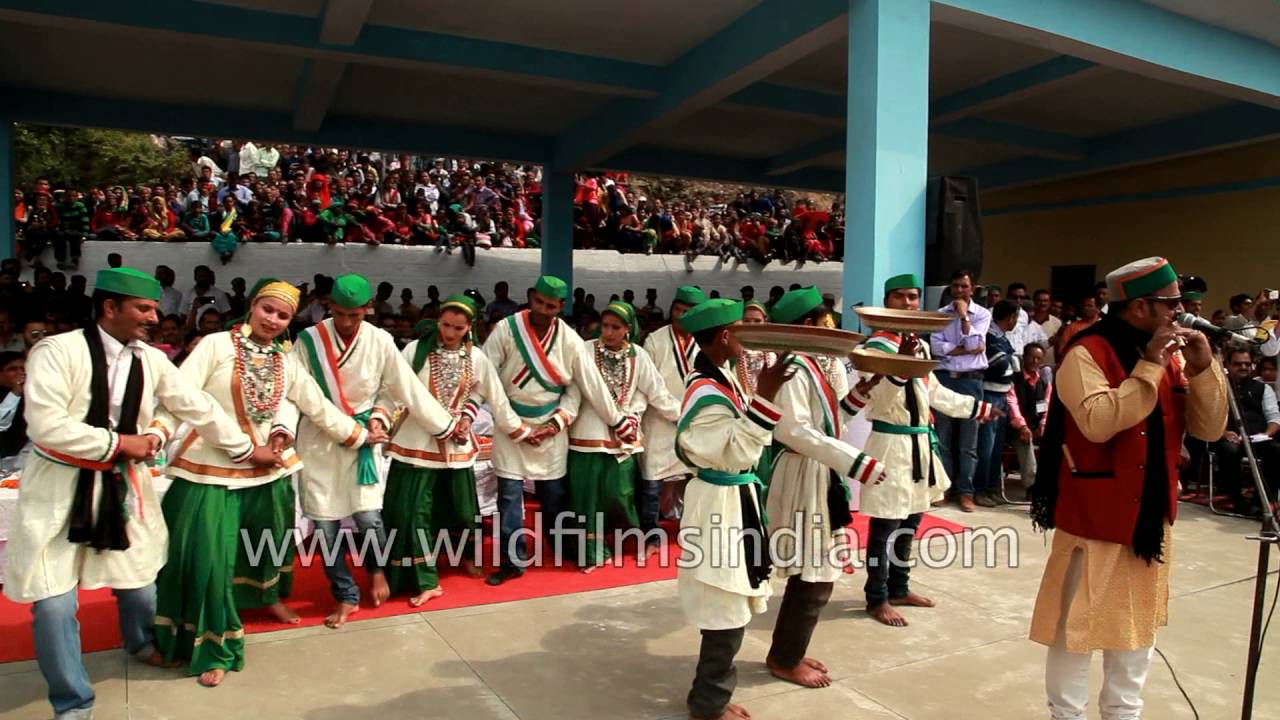 Jaunsari folk dancers perform to flute player Sarju Verma's tune