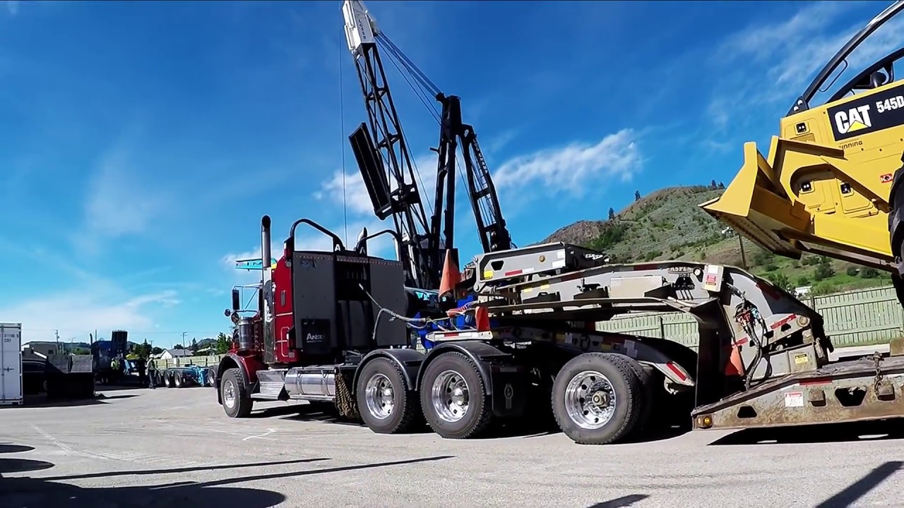 KENWORTH T800 w/ ASPEN LOWBED LOADING 2016 CAT 545D GRAPPLE SKIDDER