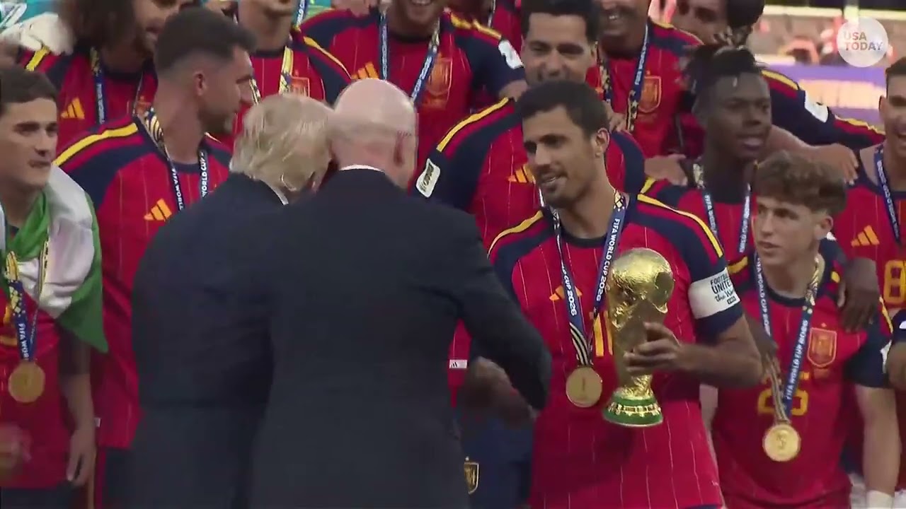 Trump booed at World Cup as he presents Spain FIFA trophy, then lingers for lifting ceremony