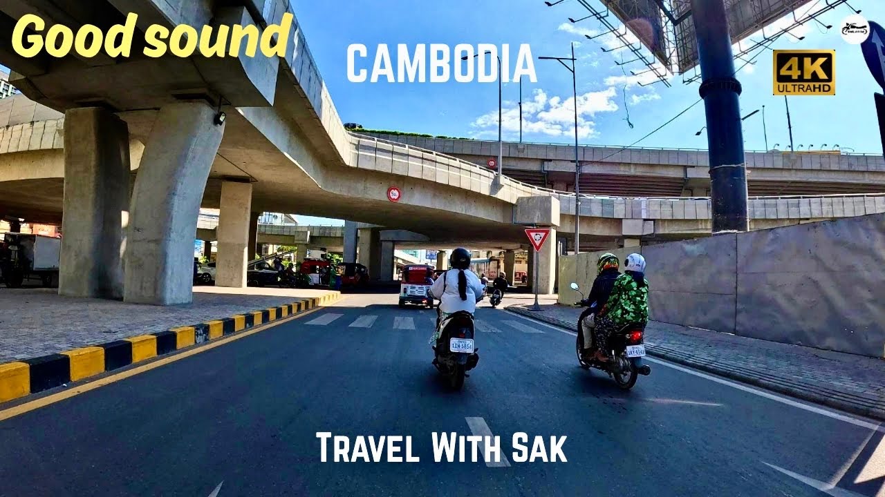 Tours Driver Street scene in Phnom Penh City of Cambodia 4K