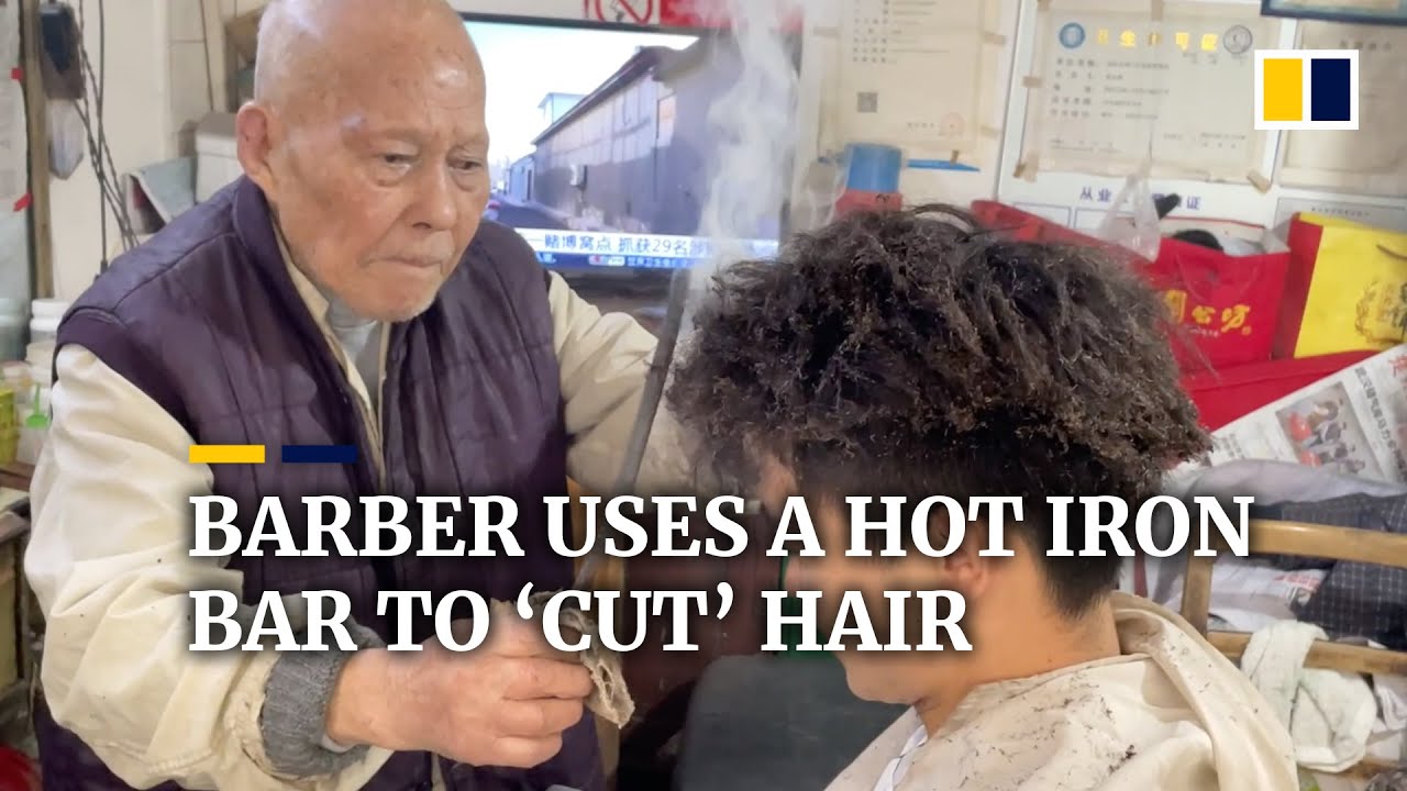 This Chinese barber uses a hot iron bar to ‘cut’ hair